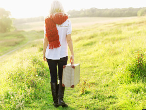 C7GPW2 A woman walking in the country carrying a suitcase. Image shot 2011. Exact date unknown.